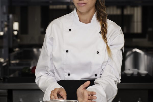 female-chef-kitchen-sieving-powdered-sugar-dessert